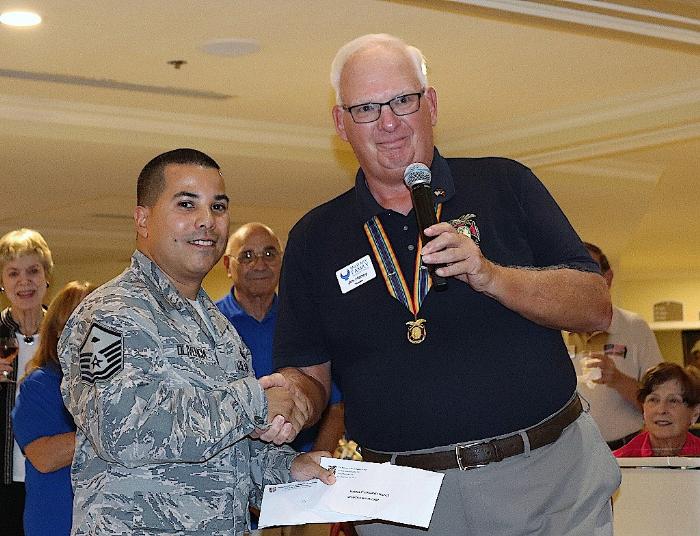 Benny Blackshire presenting check to 1st Sergeants Club of MacDill AFB at Freedom Plaza.